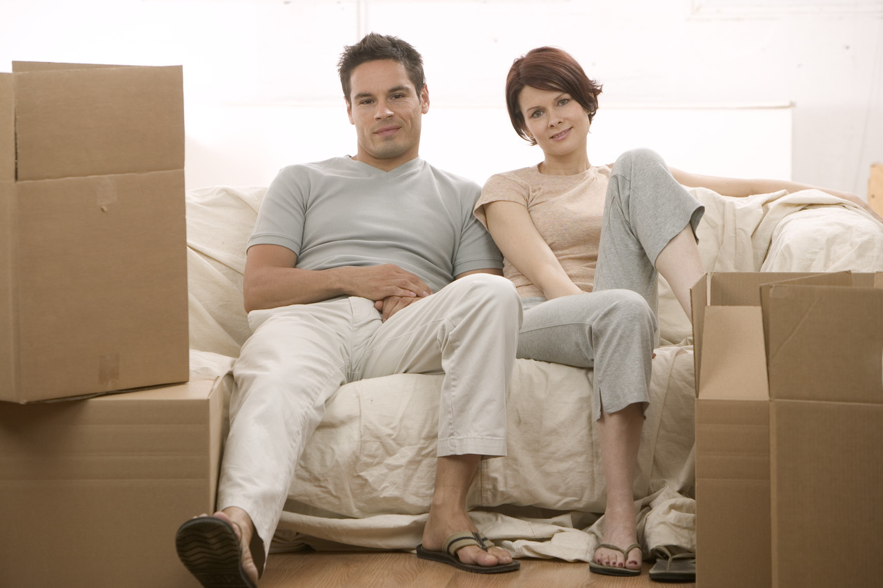 Moving Couple Sitting on Couch
